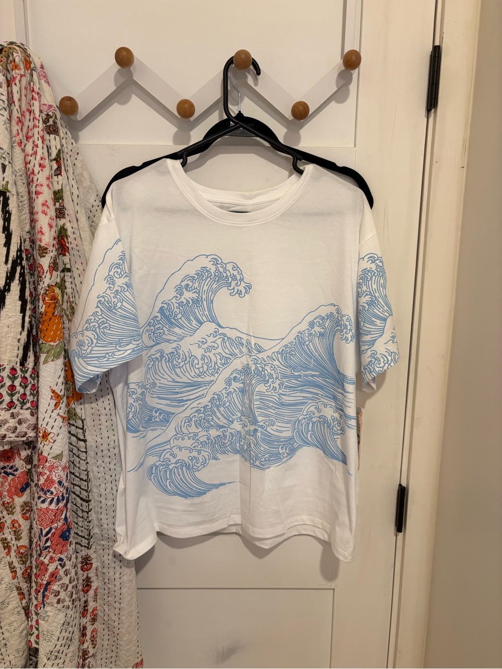 White Tee with Light Blue Wave Graphic and Organic Collective Tag